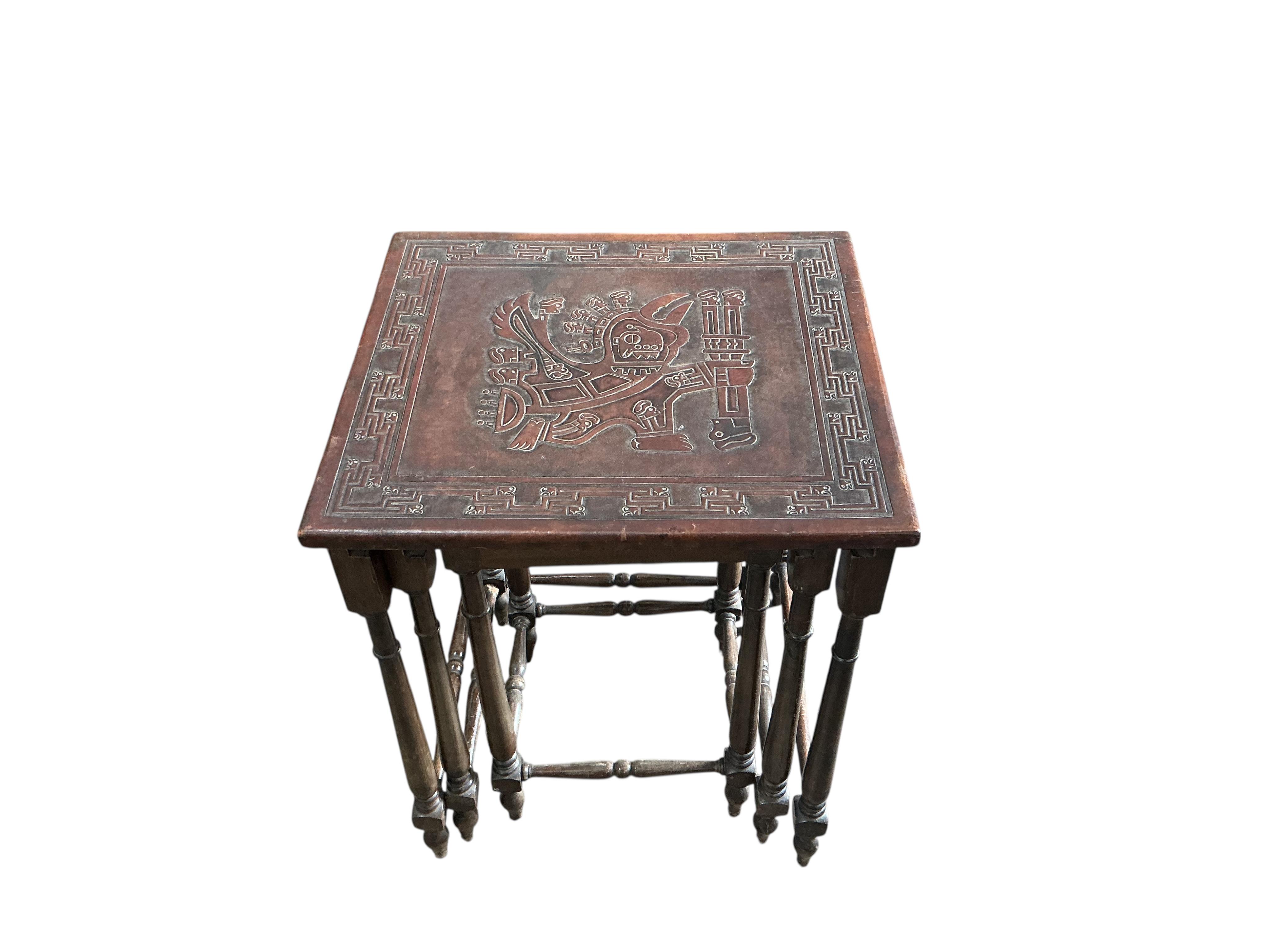A Peruvian rectangular embossed leather turned wood coffee table, width 128cm, depth 50cm, height 42cm together with a similar nest of tables